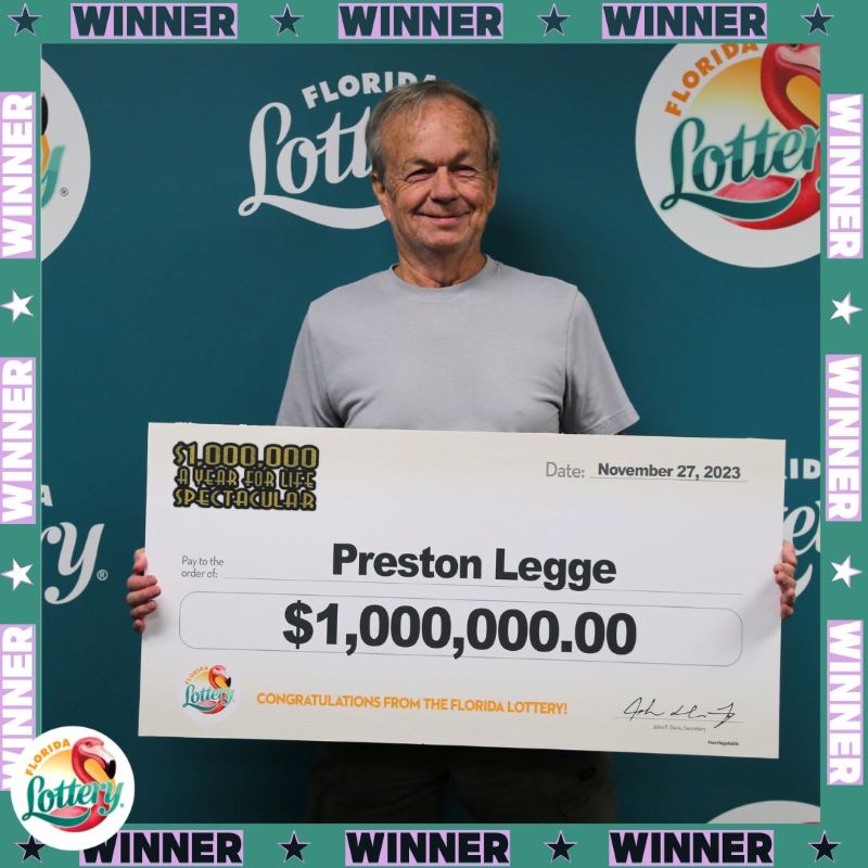 Preston Legge posing with a $1 million check at the Lottery Headquarters in Tallahassee. (Photo: Florida Lottery)