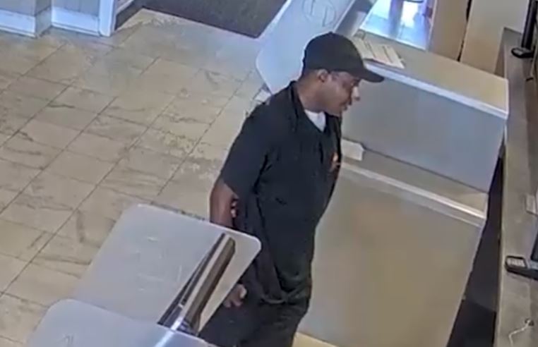 The robbery suspect approaching a teller inside the Chase Bank branch in Pine Hills on October 15, 2024. (Photo: Orange County Sheriff's Office)