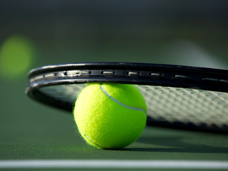Tennis ball and racket feature image