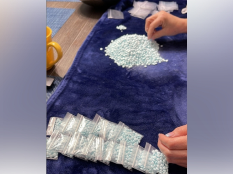 U.S. Postal Service employee Orlando Rosa Rodriguez used his workplace parking lot to sell pills containing fentanyl pictured above to customers.
