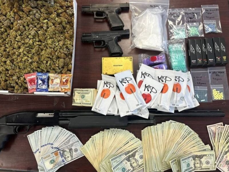 A photo of the drugs, cash, and firearms that were allegedly seized during a recent search of Jose Vasquez III's home. (Photo: Orange County Sheriff's Office)