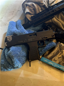 AR 15 and MAC 10 on the hood of Terrence Denard Perkins Corvette 2 of 20