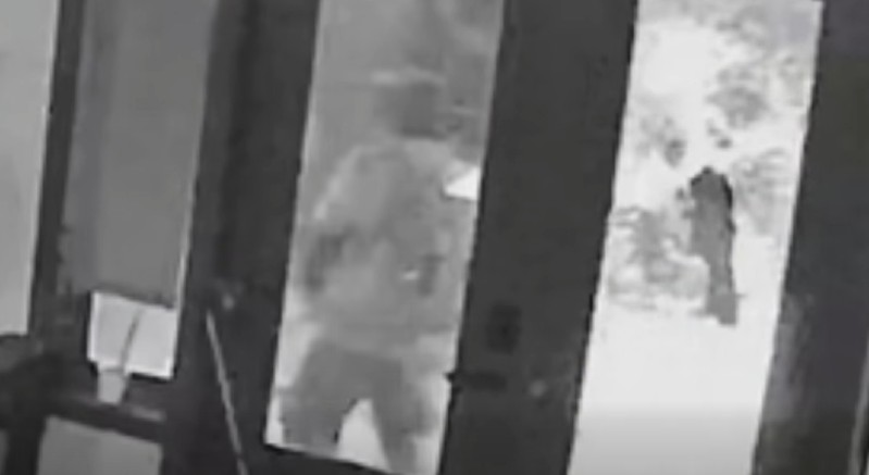 A male suspect, later identified by police as Jean Luckner Charmant, shattering a glass door in downtown Orlando on February 5, 2026. (Photo: Orlando Police Department)