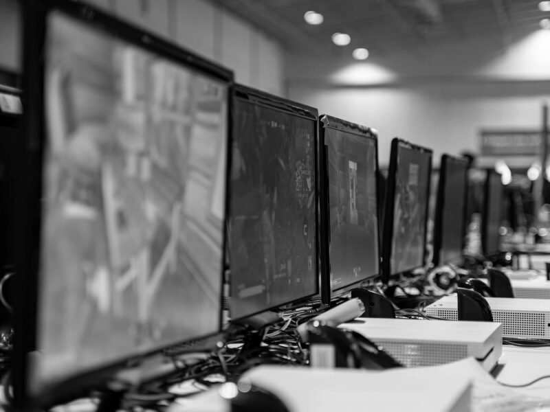 Video game consoles and televisions at a competition
