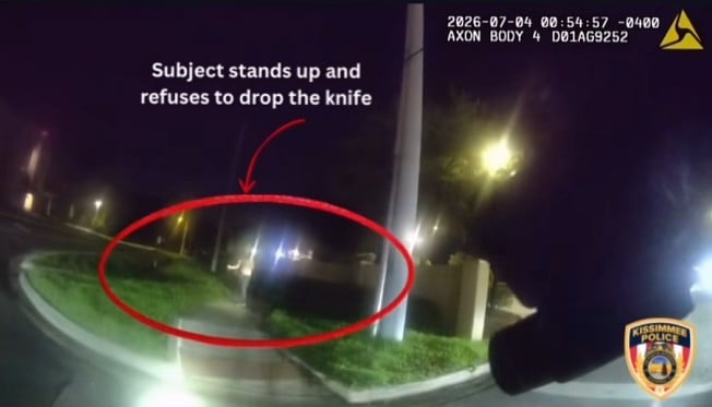 Nicholas Efrain Rosario - Suspect standing and reportedly refusing to drop a large knife